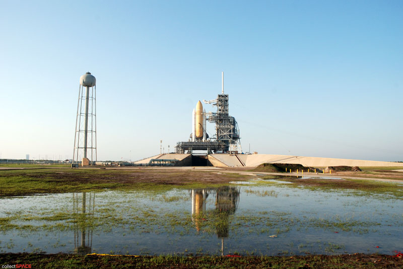 Atlantis and astronauts at the pad