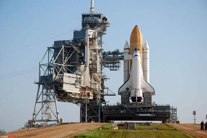 Atlantis and astronauts at the pad