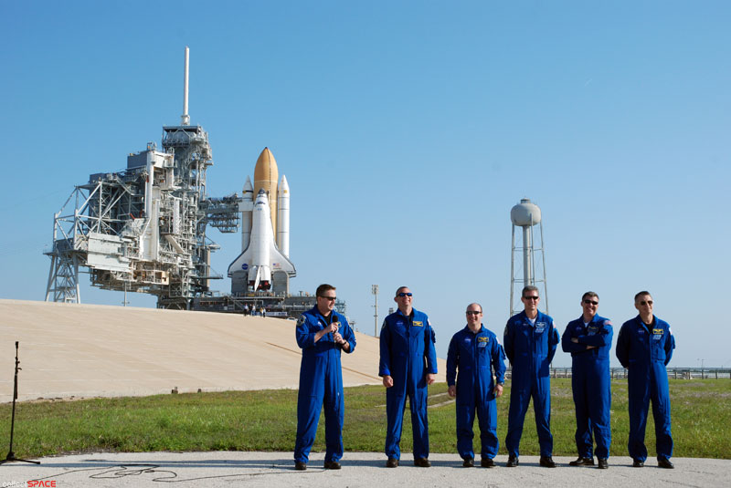 Atlantis and astronauts at the pad