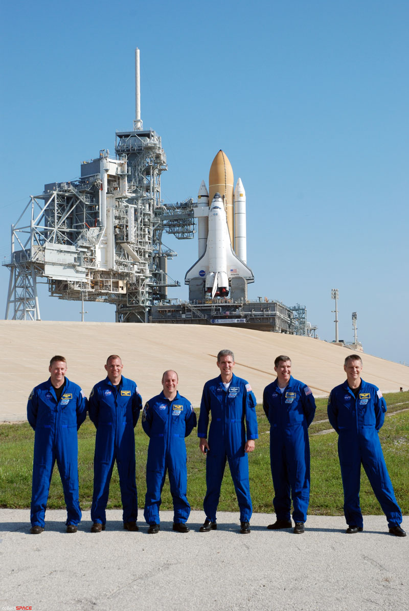 Atlantis and astronauts at the pad