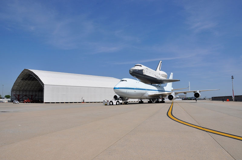 Space shuttle Enterprise hoisted off jumbo jet in New York