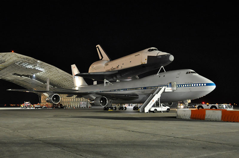 Space shuttle Enterprise hoisted off jumbo jet in New York