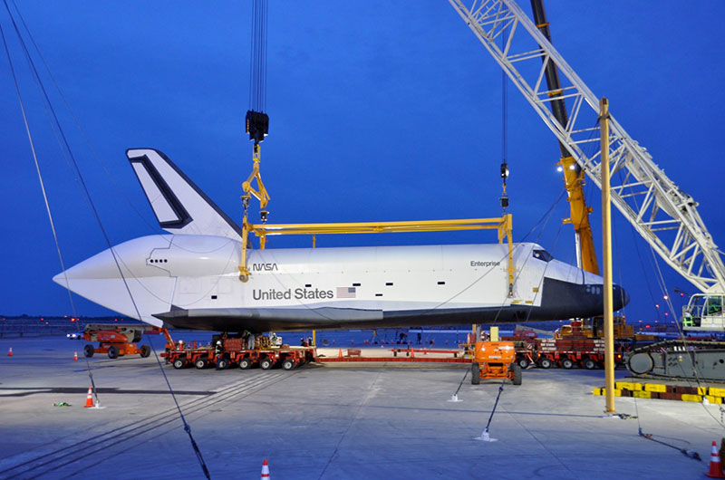 Space shuttle Enterprise hoisted off jumbo jet in New York