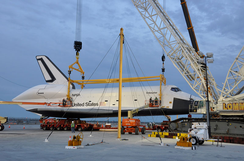 Space shuttle Enterprise hoisted off jumbo jet in New York