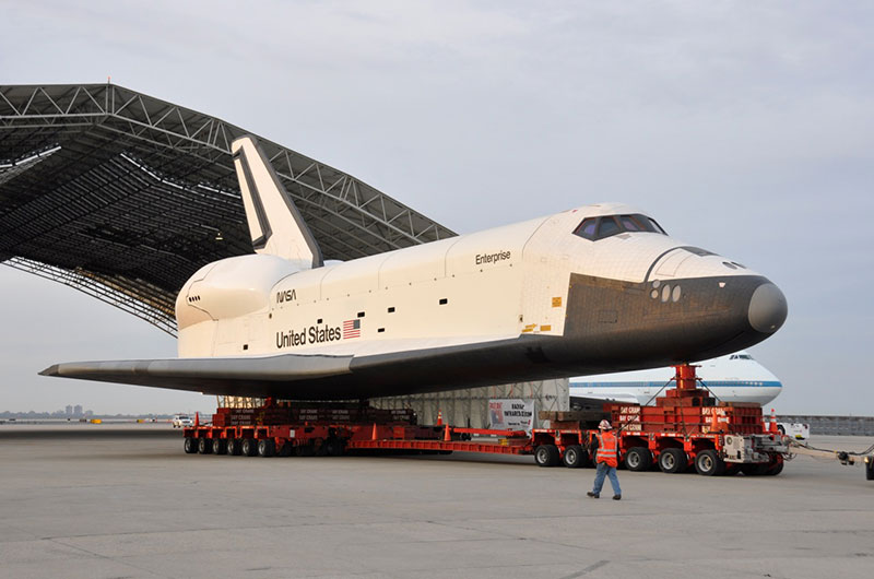 Space shuttle Enterprise hoisted off jumbo jet in New York