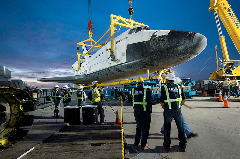 Shuttle Endeavour hoisted off jet for road trip to L.A. museum