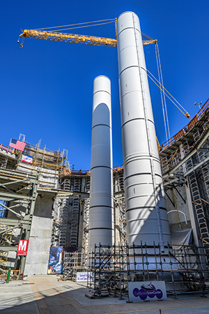 Endeavour assembly at Science Center starts with lifting 52-ton rockets  into place