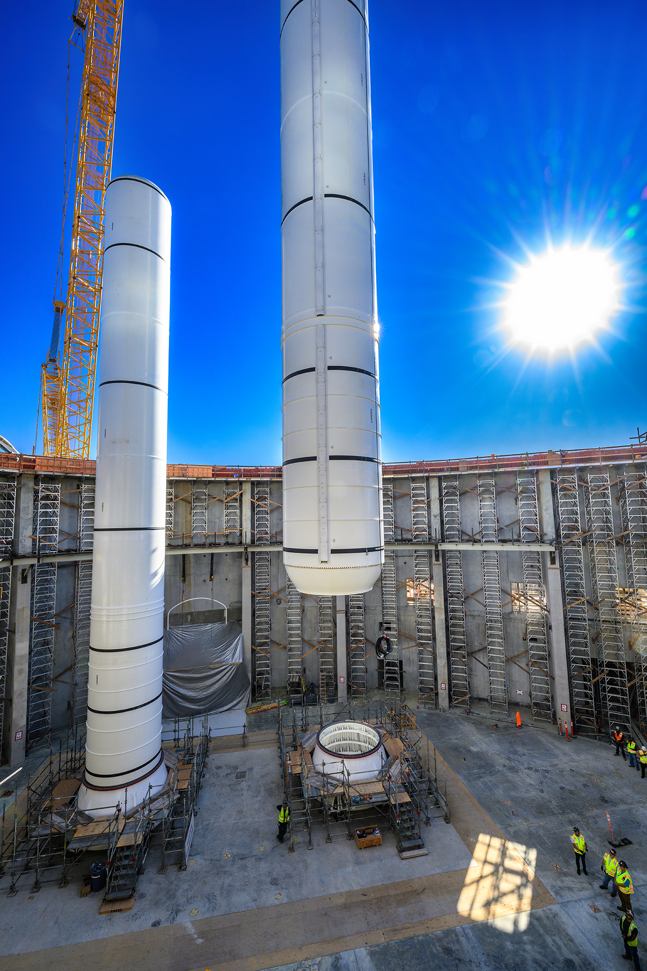 Endeavour assembly at Science Center starts with lifting 52-ton rockets  into place